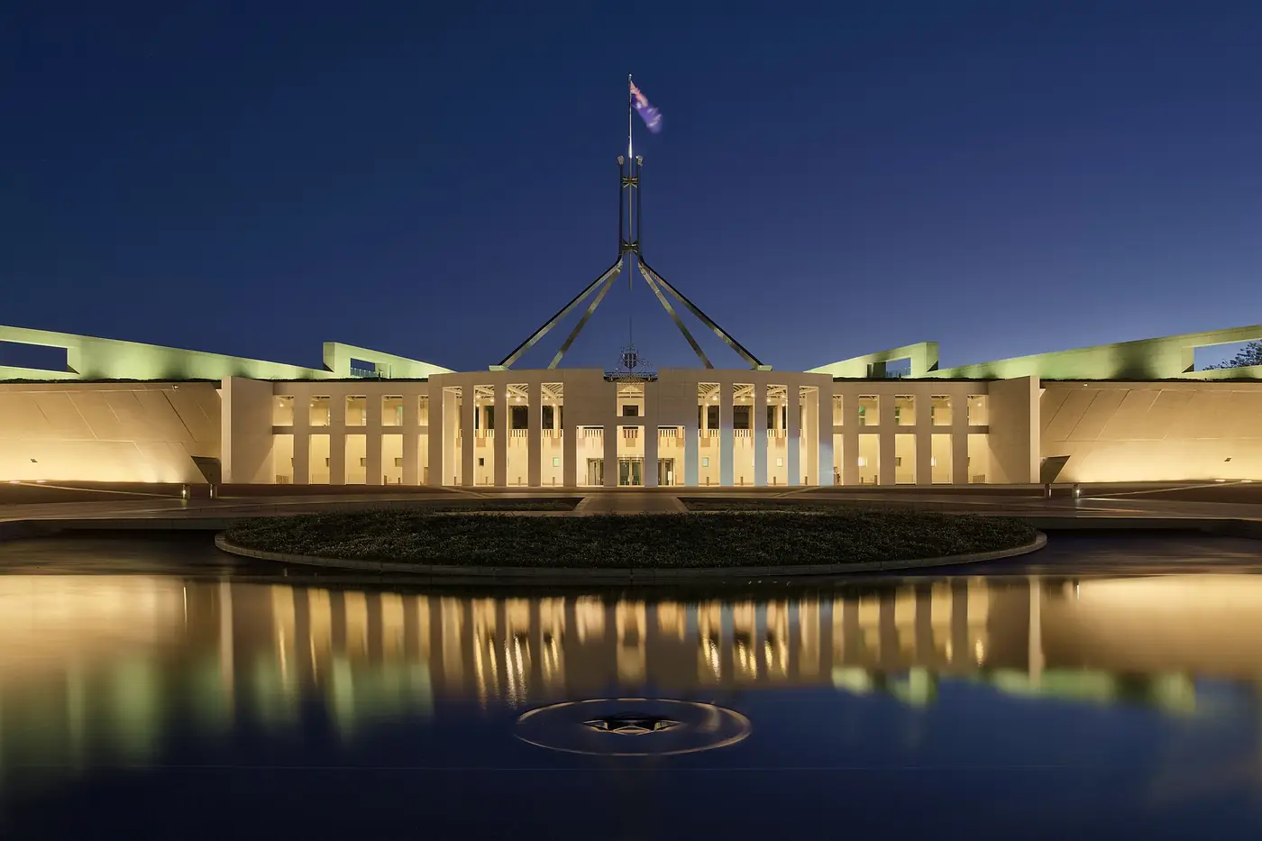 Government building lit at twilight